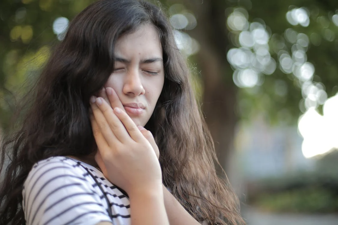 a woman having tooth pain