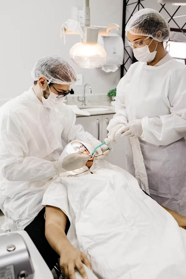dental professionals treating a patient